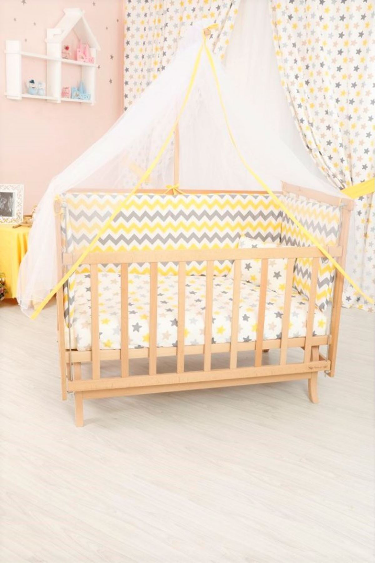 Baby cot with yellow sleep set