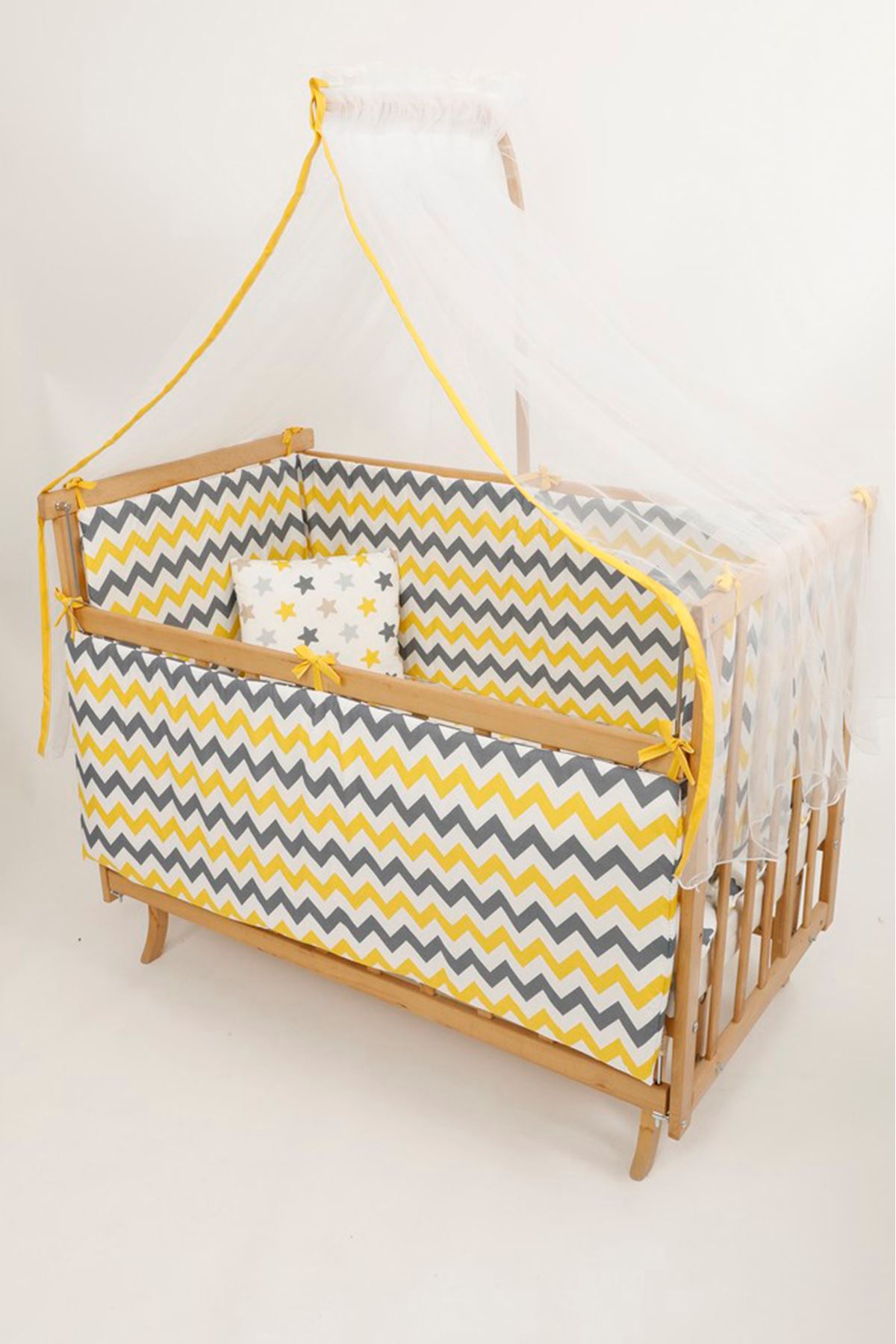 Baby cot with yellow sleep set