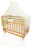 Baby cot with yellow sleep set